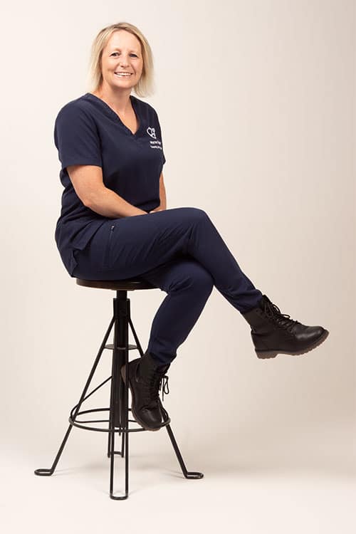 Tutor Hannah sat on a stool